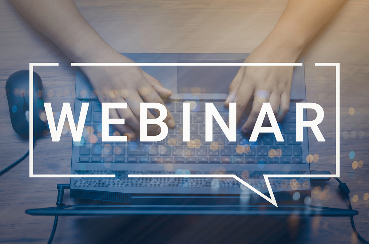 hands typing on a laptop with word "webinar" over the screen